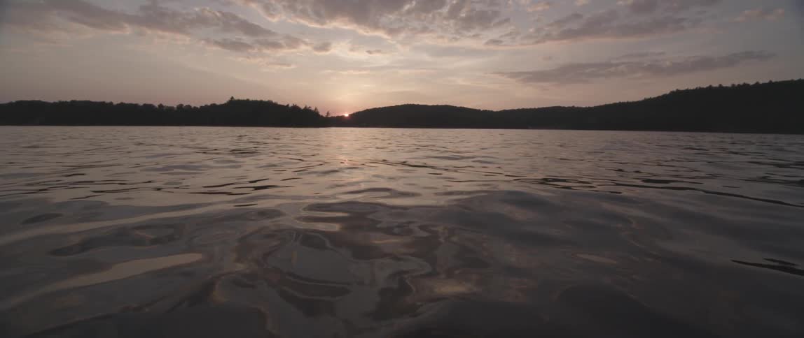 Gentle waves in a lake at dusk