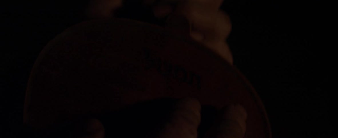 A man is holding a violin