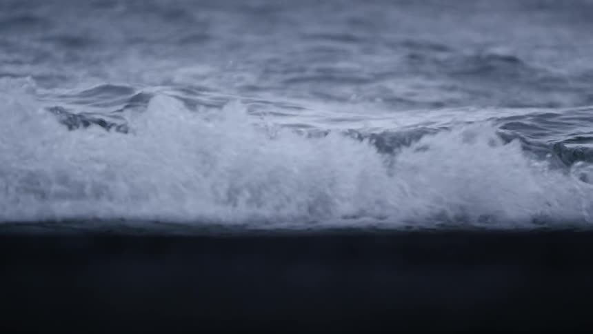 Ocean waves splashing onto a beach