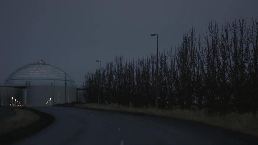 Slowly turning around a curved road at night