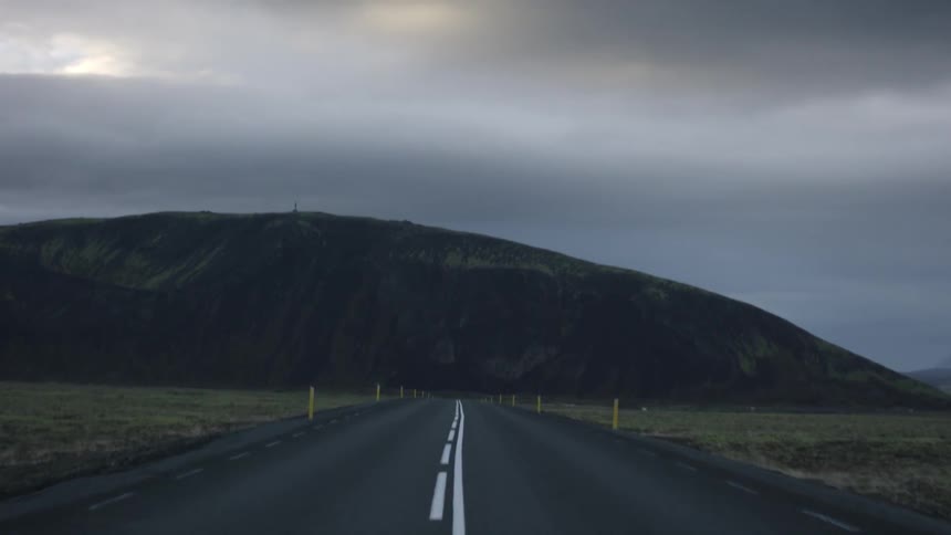 A road leading to a mountain