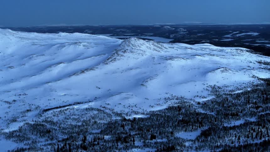 Ice and snow cover the landscape