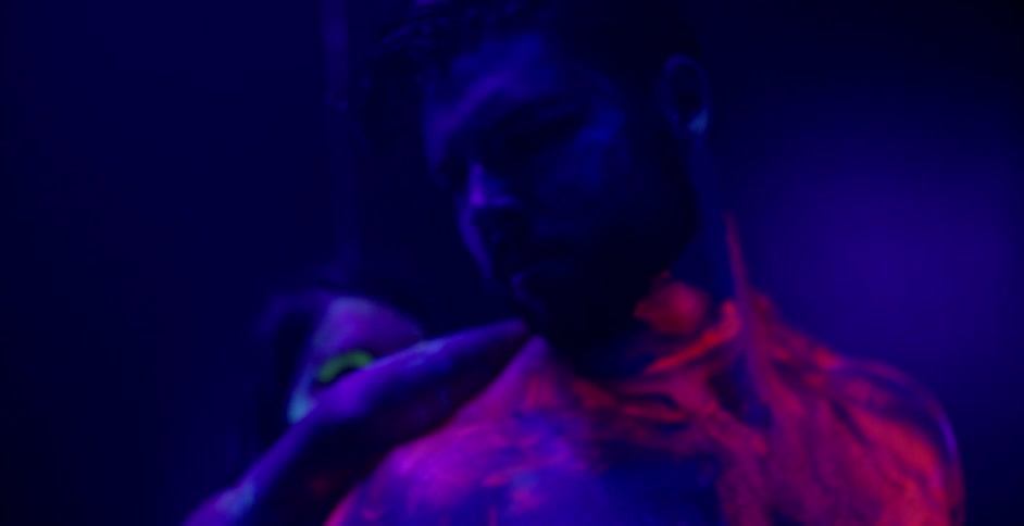 A woman caresses a man's back