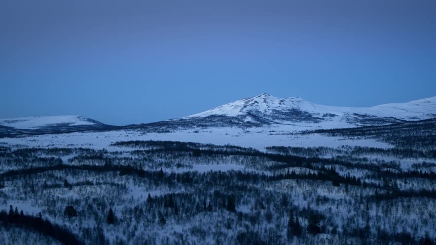 The mountains are very tall and covered with ice