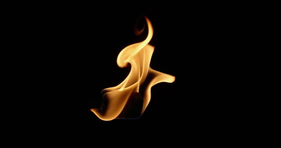 Fire burning on torch in pitch black darkness