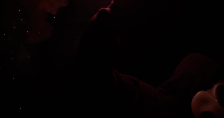 A flare is lit and held up in the night sky