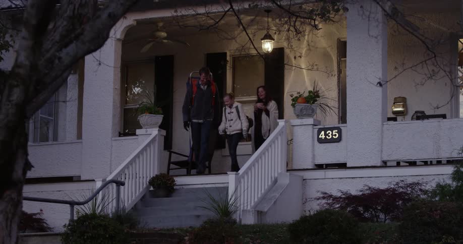 People exit their front porch together