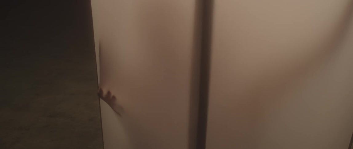 A man presses up against a lit screen