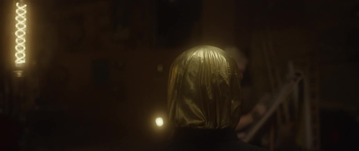 An artist draws a person wearing a metallic bag over their head