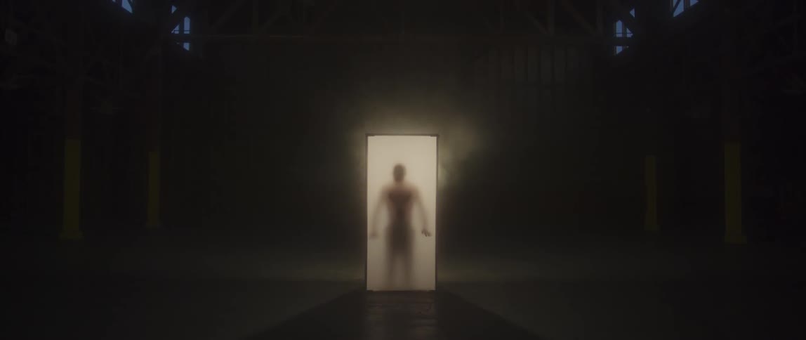 A man presses up against a lit screen