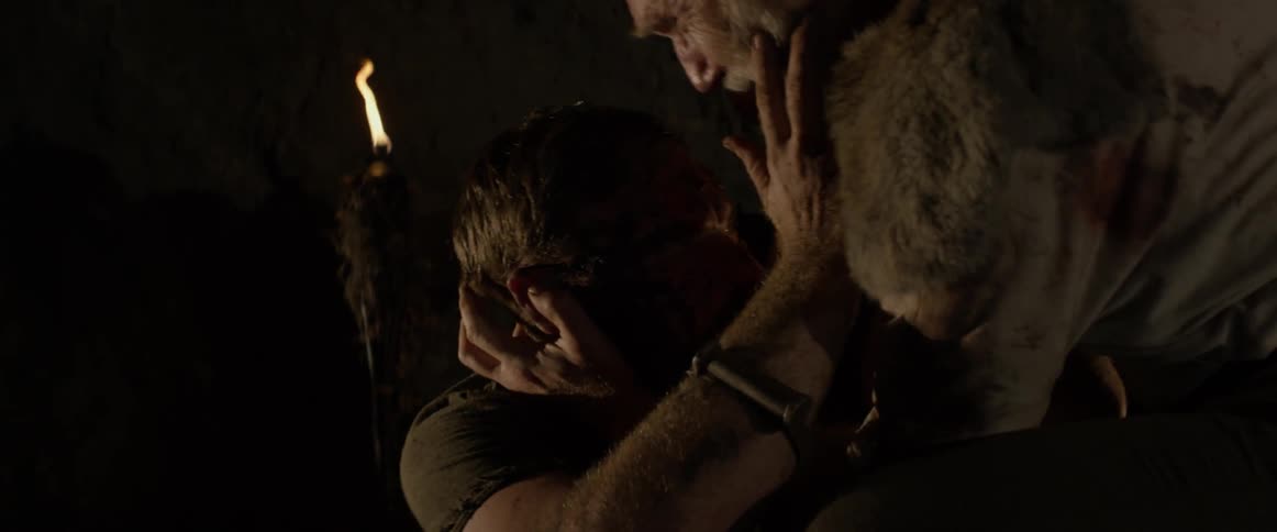 Two men hug each other