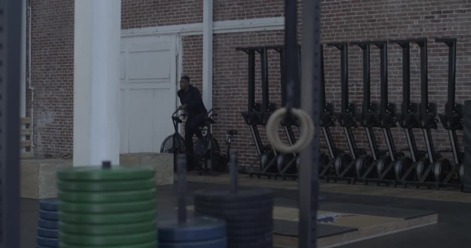 A man is using an exercise bike outside
