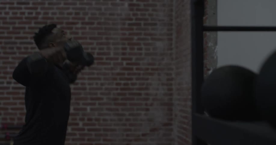 A man is lifting weights