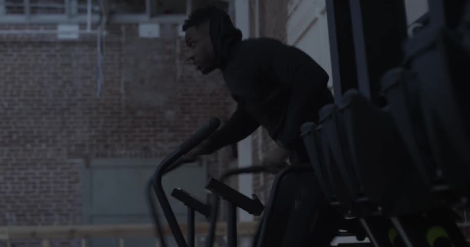 A man exercises on a cardio machine