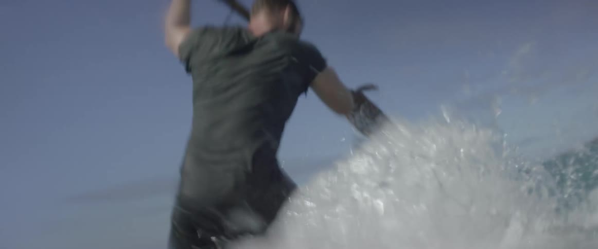 A man paddles a makeshift raft