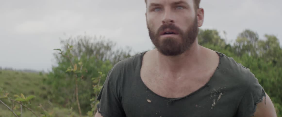 A man stares at something then begins to run