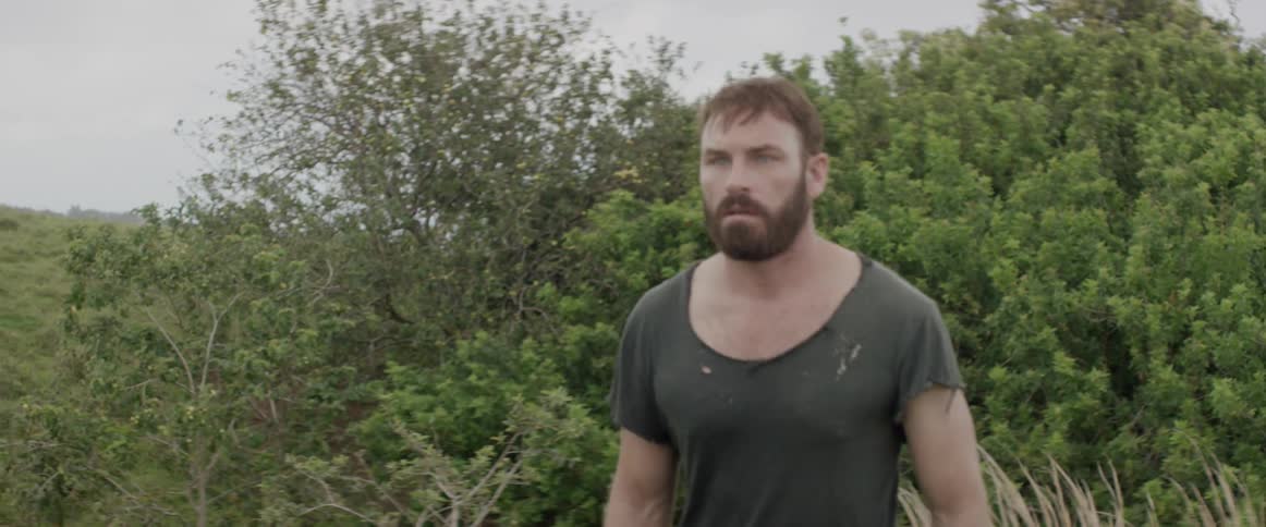 A man walks determined through a field
