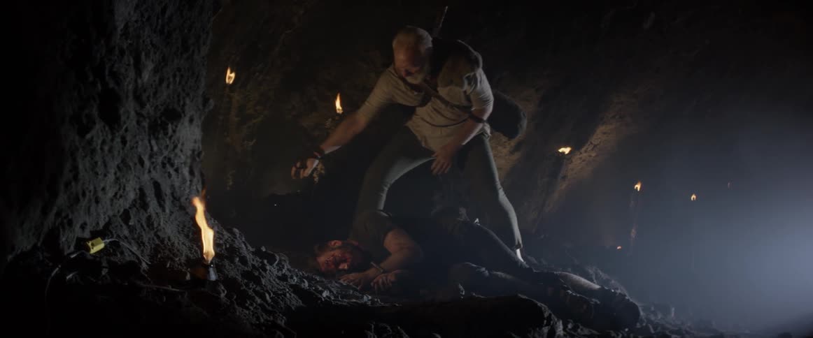 A man is walking in a cave