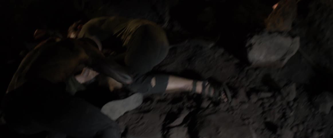 A man swings down hitting another man