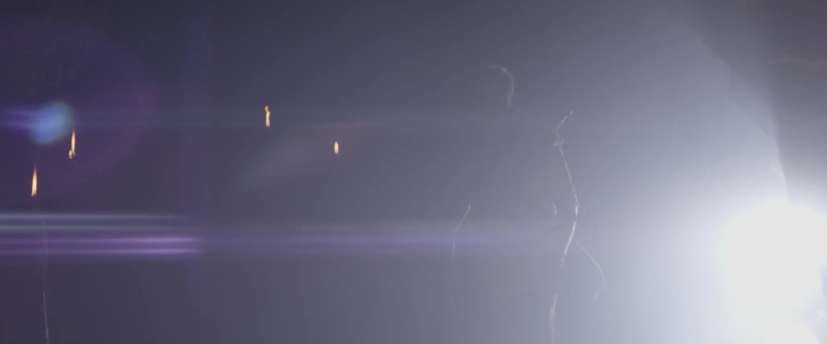 A man walks defiantly through a cave opening