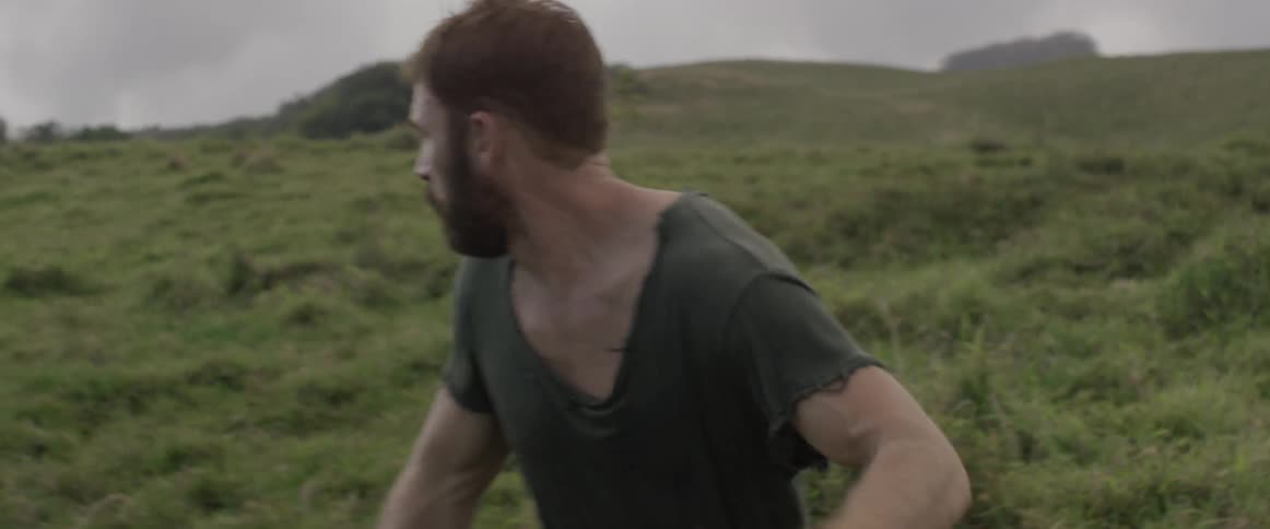 A man is running and looking behind him