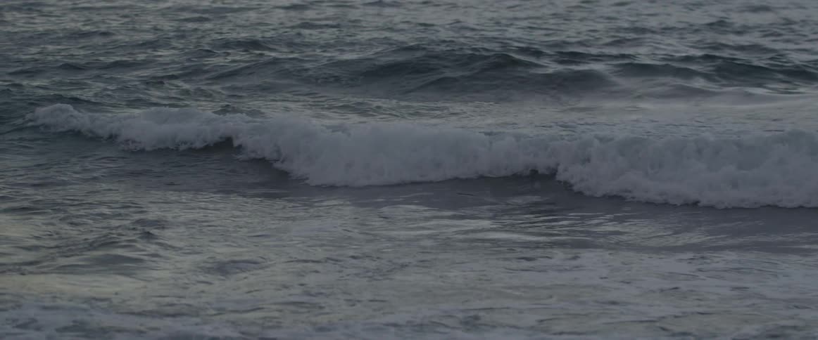 Ocean waves splash to shore