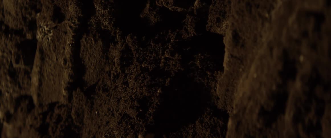 Close up of dirt in dim light