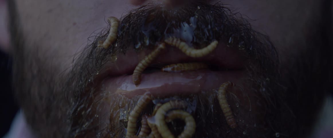 Maggots crawl outside a mans mouth