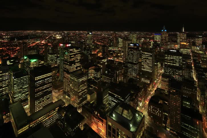 City transitions from day to to night in timelapse