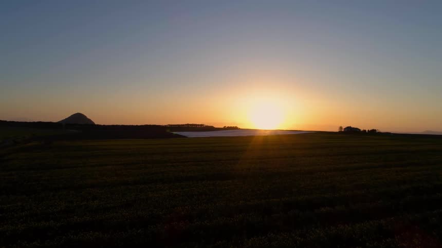 Sun rises over flat plains
