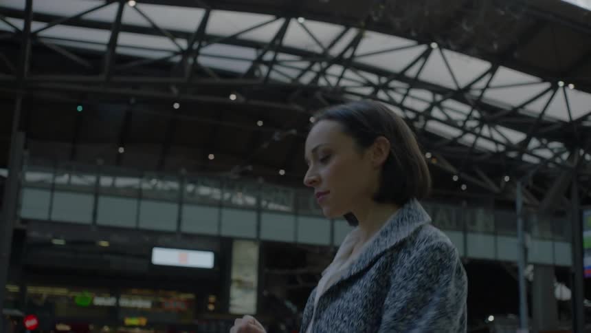 A woman walks through a terminal