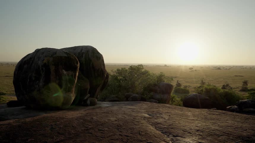 Large rocks sit under a sunny sky