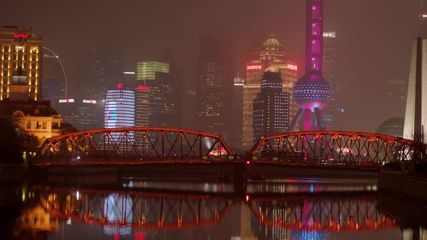 The city is foggy and bright at night