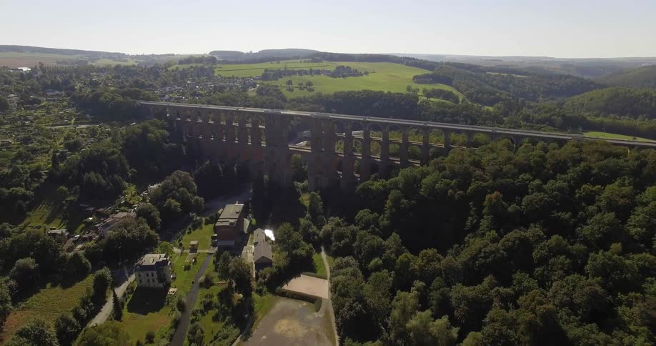 A tall bridge is being filmed from a drone