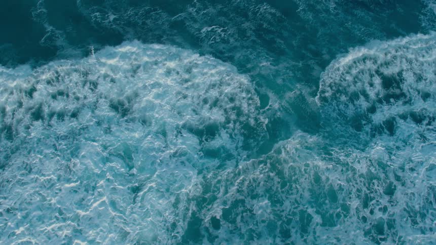 Foamy waves rush in and then recede