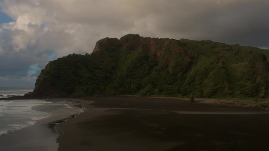 Ocean waves wash ashore a sandy beach