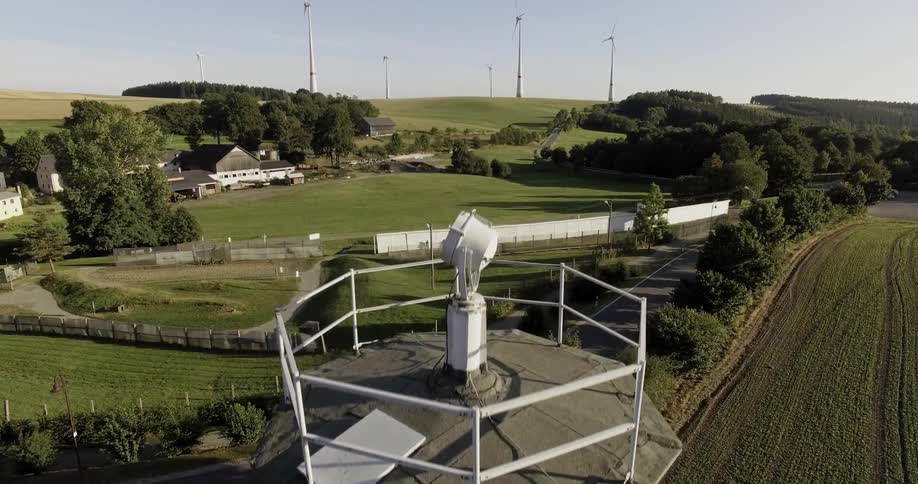 A drone is filming a guard tower at a prison