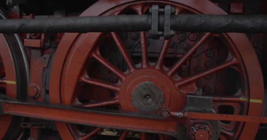 A large train engine is spinning its wheels