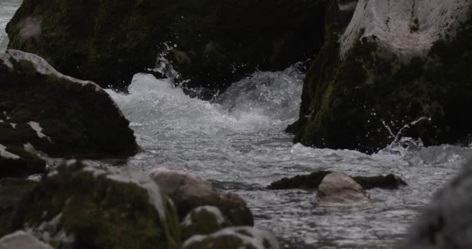 The water around the rocks are very rough