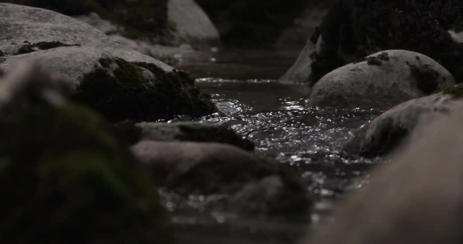 A brook running over rounded rocks
