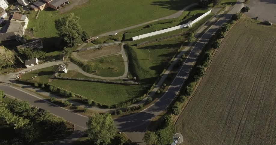 Watch towers stand over open fields