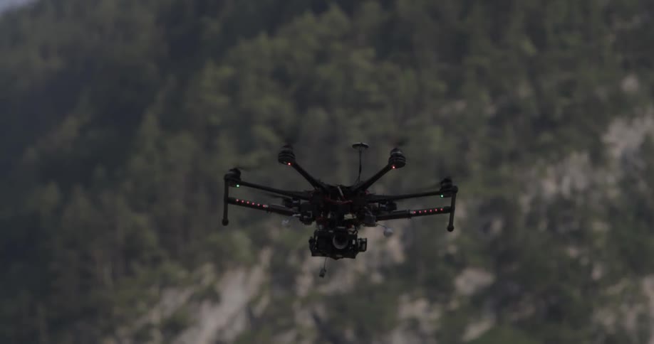 A drone is flying high in the air