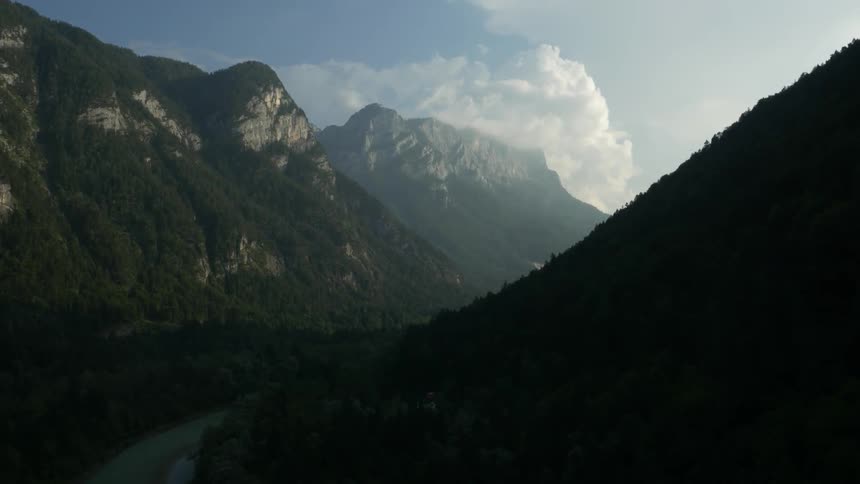 A river sits between two mountains