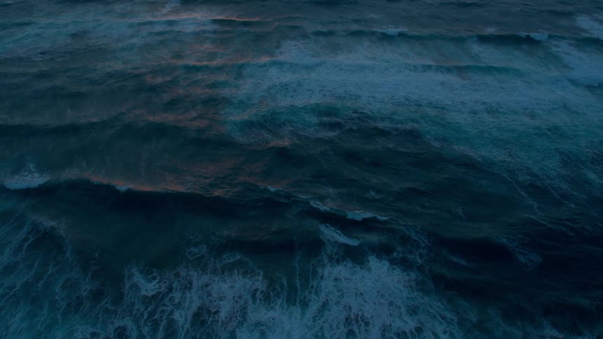Waves flow onto the beach shore