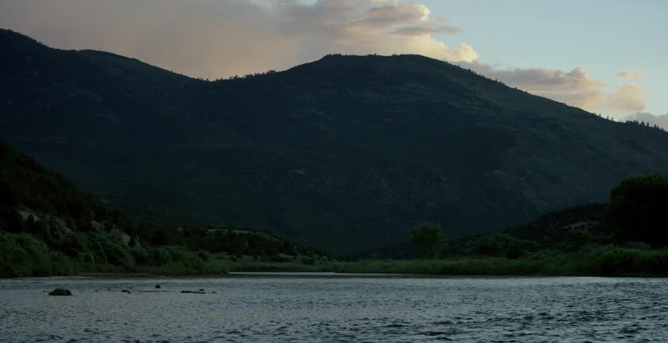 Water flows in a lake between mountains