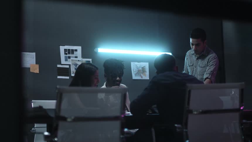 A group of people work together at a table