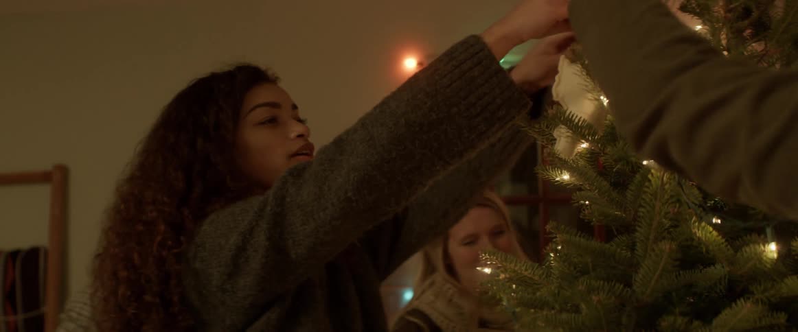 A group of people unpack christmas ornaments