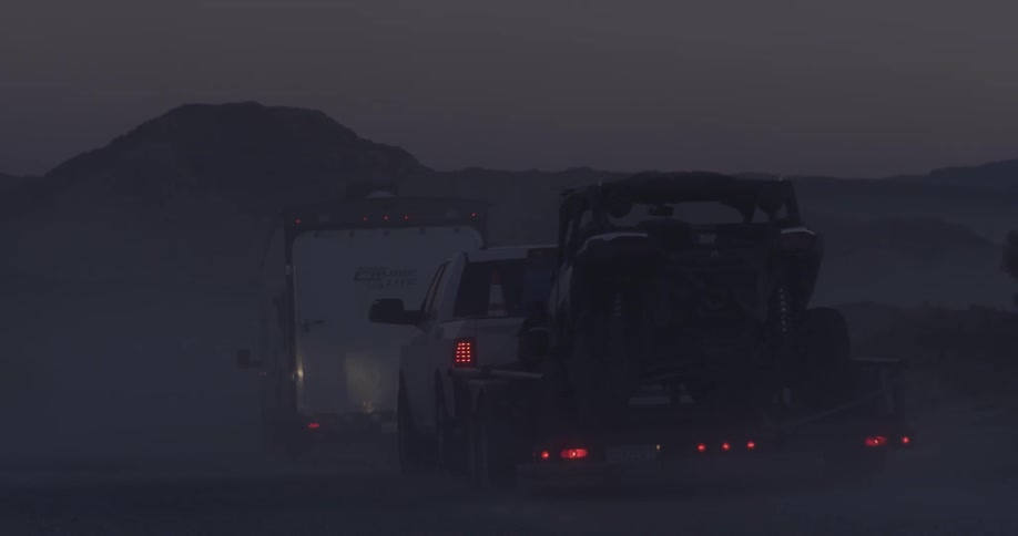 Trucks haul equipment in the desert