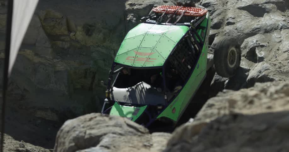 All-terrain vehicle maneuvering an insanely rocky area