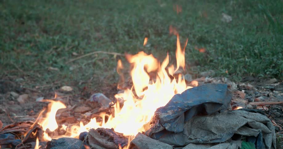 A fire burns outside